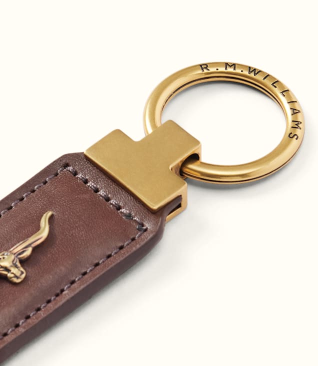 R.M. Williams Angaston Keyfob in brown leather with gold longhorn emblem and engraved brass ring