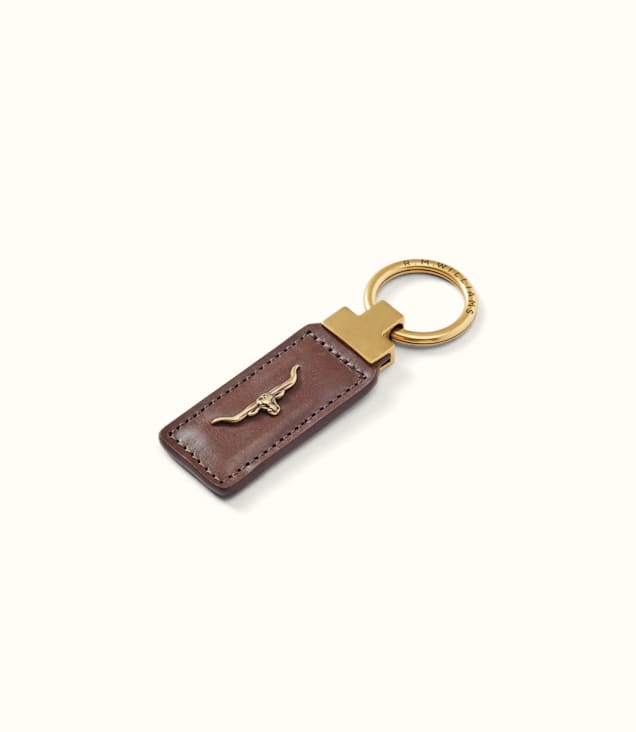 R.M. Williams Angaston Keyfob in brown leather with gold longhorn logo emblem and brass ring attachment