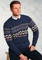 Man wearing navy blue Ainslie Fairisle crew neck sweater with traditional zigzag pattern over white shirt and burgundy tie